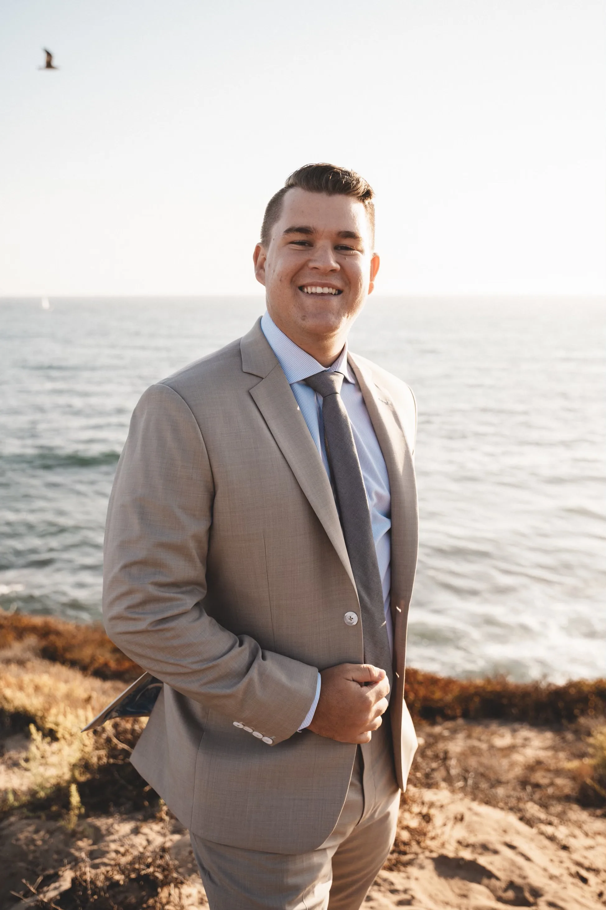 Sophisticated light gray custom suit showcasing perfect tailoring and coastal elegance by esatto Custom Clothing in Layton, Utah