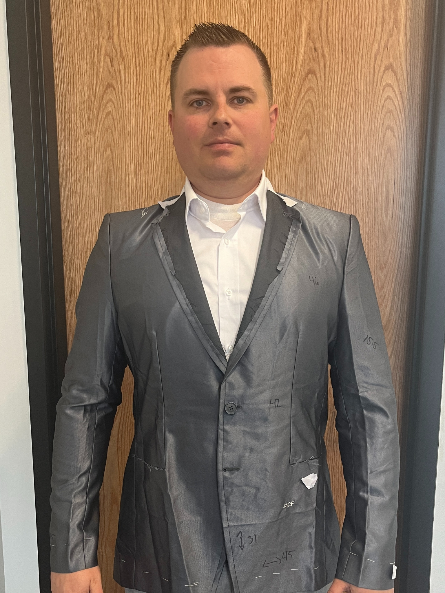 Custom suit measurement and fitting process at Essato Custom Clothing in Layton, Utah